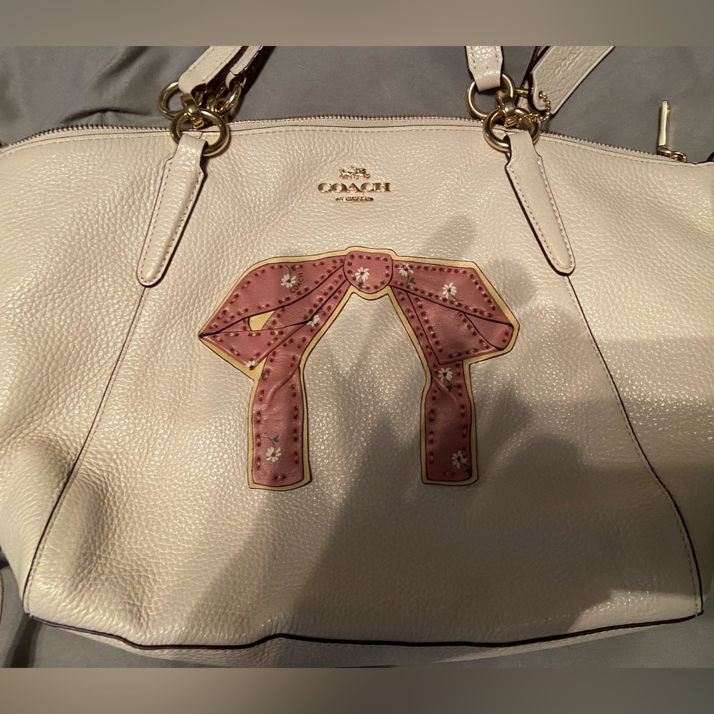 Coach bag with pink bow design